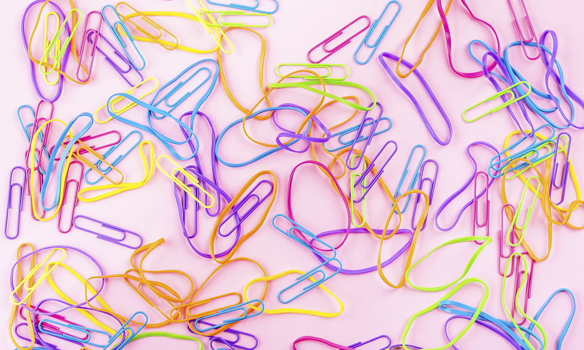 Multi-colored rubber bands and paper clips