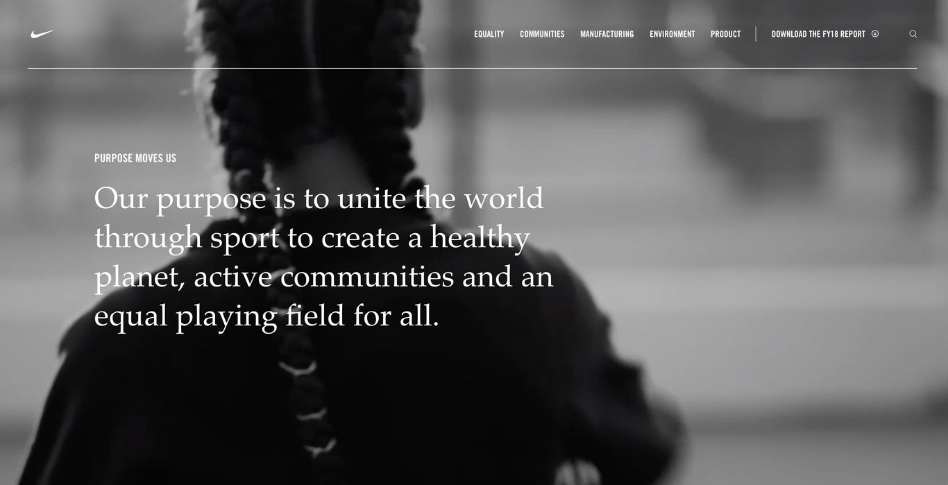 A blurred black and white image of an athlete in motion with a text overlay stating a company's commitment to uniting the world through sport.