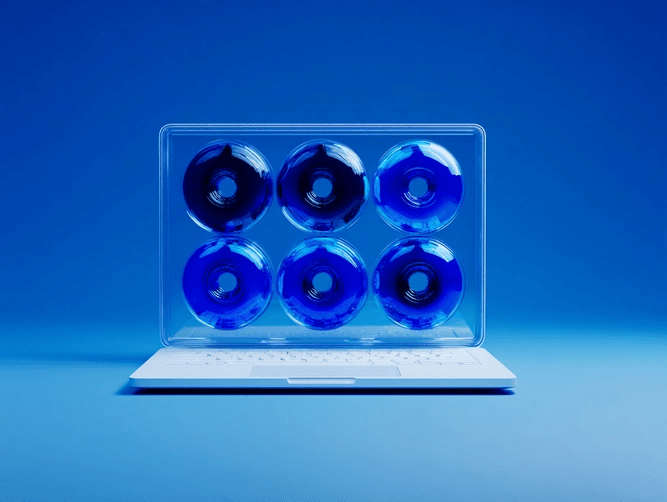 A white laptop with six blue donuts arranged in two rows on its screen, set against a blue background.